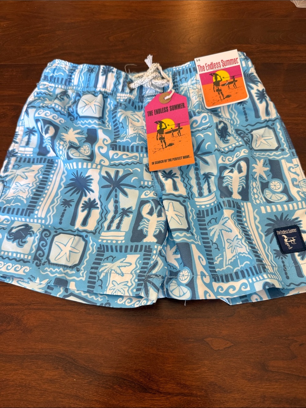 The endless summer boys size 5/6 palm print volley swim trunks NWT